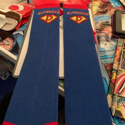 Superman cape socks that say super dad on them. 

Size 6-11 men’s