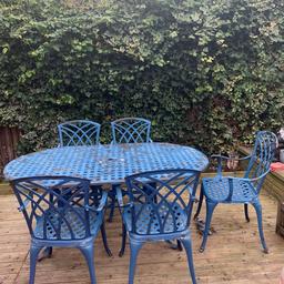 Good condition cast aluminium table with 5 chairs. Need repainting with oval table