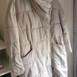 Light grey colour. Not a heavy coat but a warm coat. Thick collar that comes up the neck. Size 14 no marks or rips to the coat. 

Collection only.