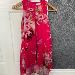 Beautiful vibrant pink Ted Baker dress age 6
In as new condition as only worn twice
Ted baker detail to button at back and to print on dress.
A bargain - cost £40 new 
Collection Manvers Wath upon Dearne