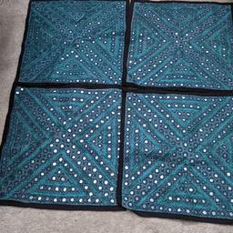 x4 cushion covers, completely new.. got as a gift that I never used.

amazing colours of blue with mirror work

15" X 15"