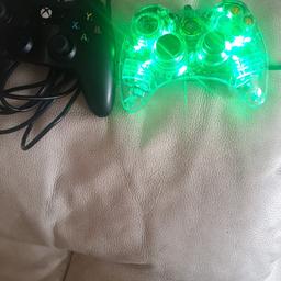 xbox USB controller for spares or repair

the black one not turn on

the glow one is on as you see on the picture
 but the only issue is the cover of the one button missing see last picture.

price for both but open to offer.

thanks for looking.