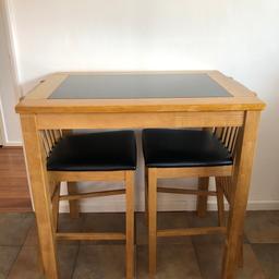 Oak, leather and granite two chair breakfast table set. Brought originally from Debenhams.