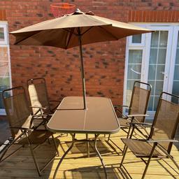 There are 6 chairs available. 
All been stored indoors. 
Parasol has not been used. 
But table has been outside some light rust in places and table top has some paint under glass worn
Glass top table. 

Now to big for my family

Brown in colour