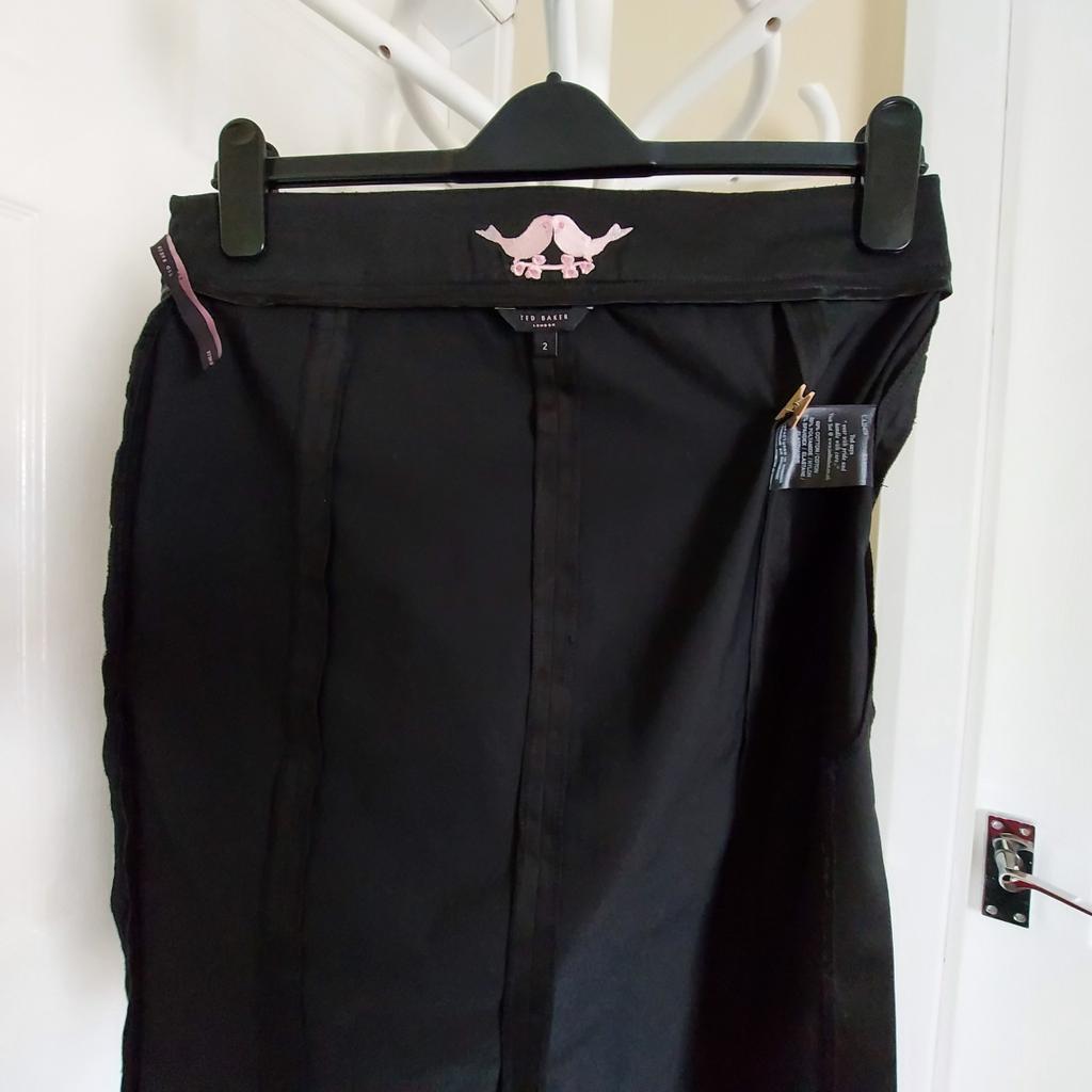 Skirt ”Ted Baker” London Black Colour
New Without Tags

Actual Size: cm

Length: 59 cm

Length: 58 cm side

Volume Waist: 76 cm – 80 cm

Volume Hips: 83 cm – 85 cm

Size: 2,10 (UK) Eur 36, US 6

60 % Cotton
35 % Polyamide
 5 % Elastane

 Made in Heaven