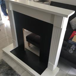 Wooden White fire surround in fair condition. 47” length . 43” high . 16”depth . Collection only