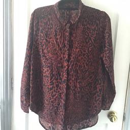 Leopard print shirt 
Size 16 women’s. 
Worn a few times and sorted away so in good condition! 
Lovely button up shirt.
