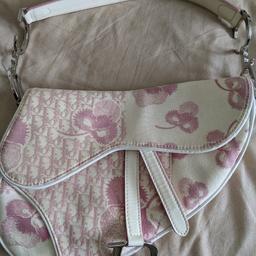 2004 pink and white cherry blossom design saddle bag. Bought in Harrods 2005, has authenticity card but lost original dust bag. will send in a replacement dust bag. Been used but in excellent condition. slight discolouration due to age and a small mark on top of handle but can be professionally cleaned. All metalwork and lining in perfect condition. Will respond to reasonable offers but this is genuine vintage so won't respond to silly offers.