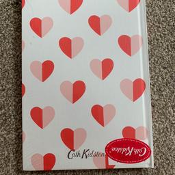 Brand new cath kidston notebook 
Red and pink heart print 
Unwanted gift 

Can post or collection 😊