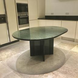 This is a high quality designer dining table from the 1970's / 1980's. It is very chic and looks modern today as it did over 30 years ago.

I cannot find a maker's name so cannot attribute it to a particular designer. It is in the style of 'Willy Rizzo' or 'Pieff Pieff' or 'Pierre Vandel'.

The top is a high floss emerald green natural wood veneer with black high gloss rounded edges.

The table seats up to 6 people generously. The top has some scratches.

Collection from Holland Park W14.