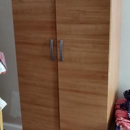 two doored wardrobe
slim and spacious
in oak effect
top shelf and rail rack
in good condition
77cmX180cm

collection from Ilford only