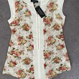 Ladies sleeveless blouse size 14 new with tag