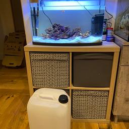 Tank is 64 litres, includes filter, heater, lights, a clown, live rock, sand, a water butt with roughly 80l of natural sea water.