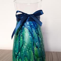 A beautiful hand-painted vase in blue and green colour. A unique technique of painting with acrylic paints. Applying acrylic paint in layers gives a three-dimensional effect.

This vase is definitely personalised,
because only one copy is possible.

Finished with a satin ribbon in perfectly matching colour.

A satin water resistant varnish protects this vase. I only used non-toxic products to make it.

Check out my others listings