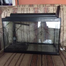 Fish tank comes with an under gravel filter and a heater plus some fake plants

Had a new light tube fitted last month but some how lost the screws that hold light to the lid 

Used condition 
Collection only