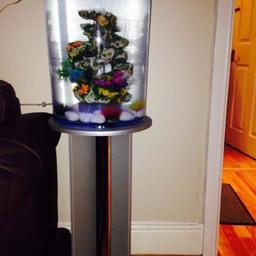 Biorb tank, comes with heater and pebbles and coral. It includes the colour change light. Also come with stand.
Pick up only.