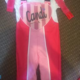 aged 4-6 only worn a couple of times on a weekend break good condition Candi costume comes with the fur wrist bands . Full costume .