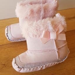Baby girl pink pram boots, one size.  Velcro fasteners on the inside.  Worn once, collection from Ribchester or happy to post for postage fees.
