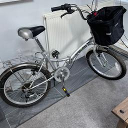 Stow bike. Ladies folding bike only used a few times selling due to knee injury comes with a removable basket (brand new) and has bag rack on the back beautiful bike in nearly new condition. GRAN A BARGAIN