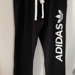 Adidas jogging bottoms for woman. Size 12. Slim fit. Cuffed bottoms. Never worn with tag. RRP £40