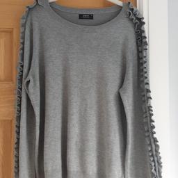 grey jumper, ruffle sleaves
in good condition with signs of wear
size 16