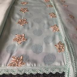 Brand new 3pcs unstitched suit 
Shiny rose prints on kameez with shiny gold embroidery on front kameez, back kameez without embroidery 
Matching embroidered dupatta 
Stunning silky shiny suit for any occasion 
Reduced to clear 
£2 postage