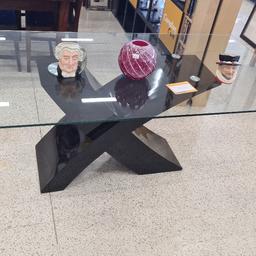 large designer dining table glass and black X.