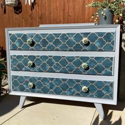 Beautiful vintage style dresser, painted Grey/blue.  papered with Emerald Green & Gold trellis wallpaper, and drawers complete with decorative knobs, this is a popular style at the moment and will add a bit of glamour to your room

There may be a few minor discrepancies, as listed above, this is not a new piece of furniture.
