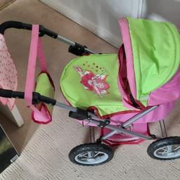 Dolls pram, in good condition from grandparents home. Come with one doll and a few accessories.