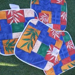 4 multi coloured chair pads. New. 15"×15".