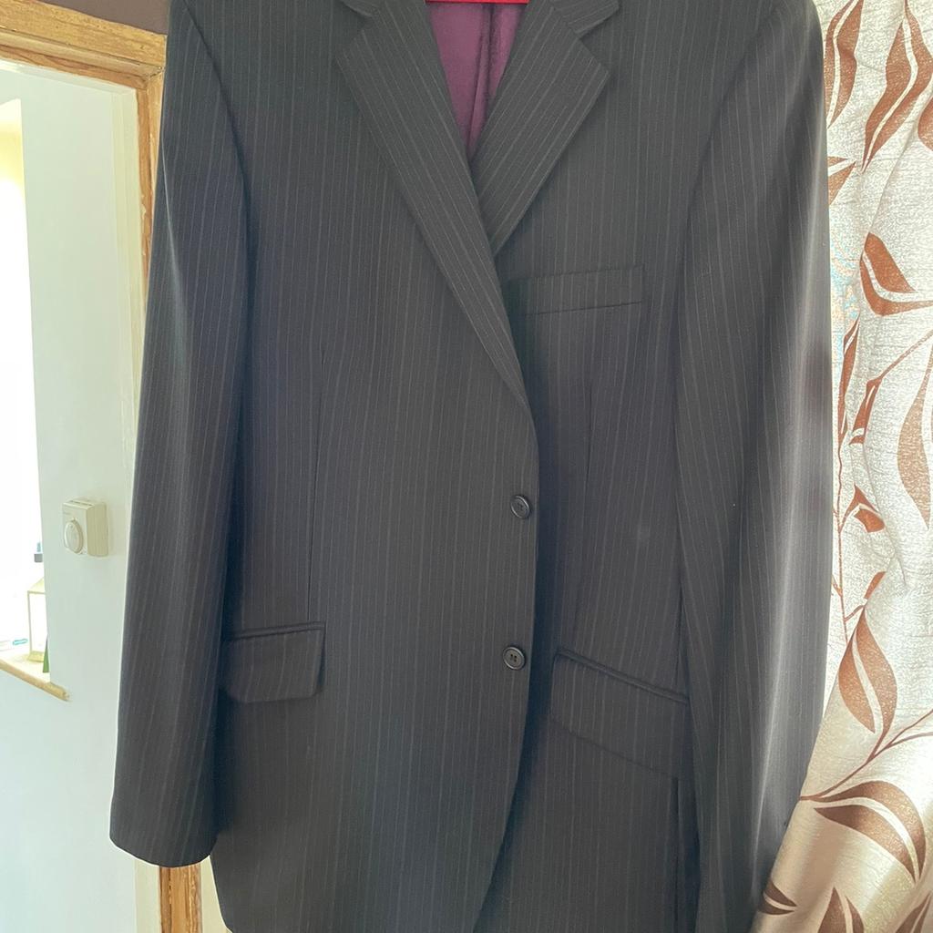 Men's suit, stripe pattern to both jacket and trousers with purple lining in the jacket. Three internal pockets, one of which is small. From a Smoke free home with 2 cats, but items have been stored in a wardrobe since first Lockdown.
Reduced price, lower offers considered.