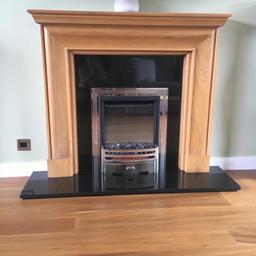 Laura Ashley natural oak surround and black granite hearth and backing.

The fire is not working or doesn’t seem to be but you’re welcome to take it and try and fix it if preferred. The price is reflected as the granite and oak fire surround and hearth.

A standard size electric fire can easily be replaced into the fire place.

Please refer to the dimensions on picture and check all measurements related to Hyacinth with shelf option.

Will be dismantled for buyer and ready to go