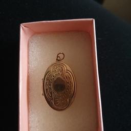 lovely 9ct Gold locket, holds 2 photos. 
£50 ONO.