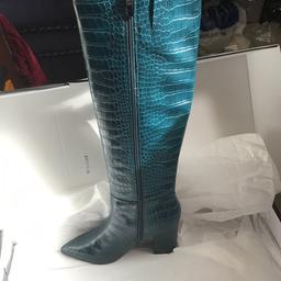 High heel turquoise moc crok knee high boots.