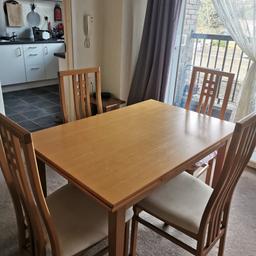 4 seater dining table with 4 chairs good condition extends to a 6 seater. Must collect please