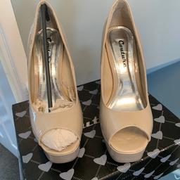 Platform style nude peep toe high heeled shoes.
Worn once. Still in box