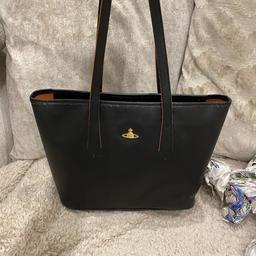 Vivienne Westwood Medium sized, black soft leather Tote handbag.
I am selling this bag and some others due to them just being wasted and not used 😪 I have 3 under 5 so handbags have been long swapped for a changing bag for me 😂
This bag has been used a handful of times as you can see by its condition. It is perfect for every day/work/uni. The bag is very deep and holds more than it looks, folders, diary, laptops etc. With beautiful striking orange suede inside, that also is thread through the