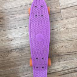 Purple Ridge penny skateboard, orange wheels, perfect for cruising around the city! Selling for lack of use