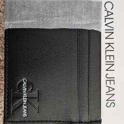 Brand new in box leather card holder. Black with the Calvin Klein logo at the front