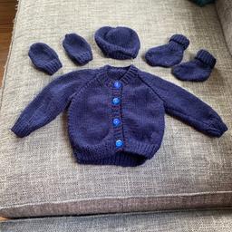 New 
Hand knitted 
Baby set 
Cardigan, hat, bootees and mittens 
Navy 
0-3 months