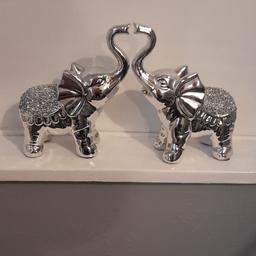 pair of crushed diamond elephants 
perfect condition 
selling as I have a hands on toddler