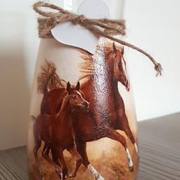 Height: 20 Centimetres; Width: 11 Centimetres

Description
Incradible beige vase or carafe with a horse.
Jute string and a wooden heart complete the look of this vase.
This vase made with decoupage technique.

It will be an absolutely incredible gift for someone who loves horses.

Height: 25cm, diameter: 12cm

Do not submerge in hot water and do not place in the dishwasher.
These vase has been given two coats of chalk paint, decoupaged and given three coats of waterproof varnish.