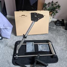 New Z Zelus steering wheel stand . Foldable. Compatible with Logitech G27/29/25/920 wheels.

Steel with rubber feet. Easy to assemble and fold away.

Comes with a Matt and fixings,. including a gear shifter mount.

Can be purchased on Amazon for £60 new. Mine was a present a few weeks back but I didn't get a Logitech wheel!!