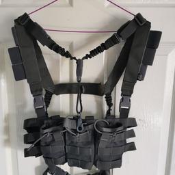 Primal chest rig in desirable grey colour. Triple mag pouch and detachable single point sling £30

Basic black vest with several pouches £10

Blackburn