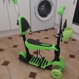 BRAND NEW.
(I have two of these available - 1 flat packed and this one already made for you :) )

With removable seat & push handle & height adjustable handlebar, this three-wheeled scooter is also a Baby Stroller, Baby Walker, Kick Scooter and Balance Bike. 

Recommend Age: 2-8 years old