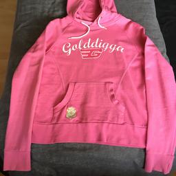 Pink Hoody by Golddigga, label says size 10 but fits more like an 8. Tiny click in material on cuff as shown in last photo.
Would fit older kids/teens.