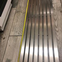 Silver brushed affect radiator slim and tall no brackets . Universal ones available at B&Q vgc ex showroom stock . Would prefer collecting or buyer to arrange delivery if possible.07858186498 for any other details. 