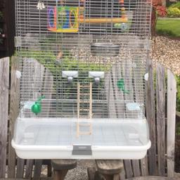 Includes toys and a bag of bird sand. 
Good condition but bottom feed trays are missing. 

Feel free to ask any questions