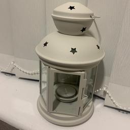 Beautiful white lantern with a tea light candle. Brand new, never used. Didn’t come with tags/packaging.