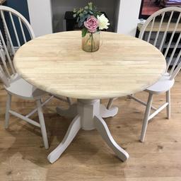 A lovely farmhouse  drop leaf table and two chairs.
Coloue:antique white with a natural wooden top. Drop leaf for easy storage
Can deliver locally